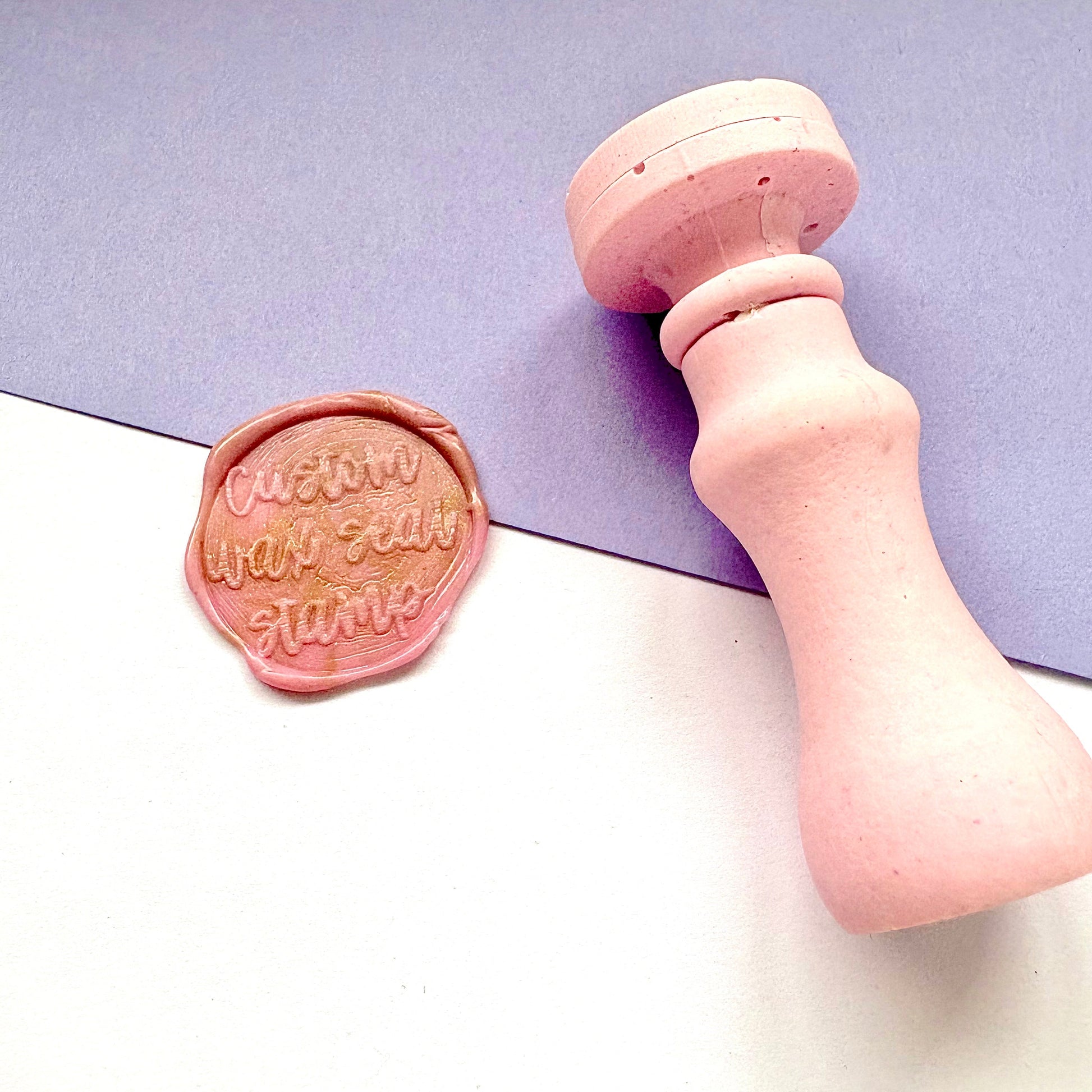 British stamp maker custom round pink wax seal stamp on a lilac background