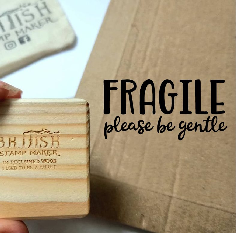 Fragile please be gentle image on a brown paper box.