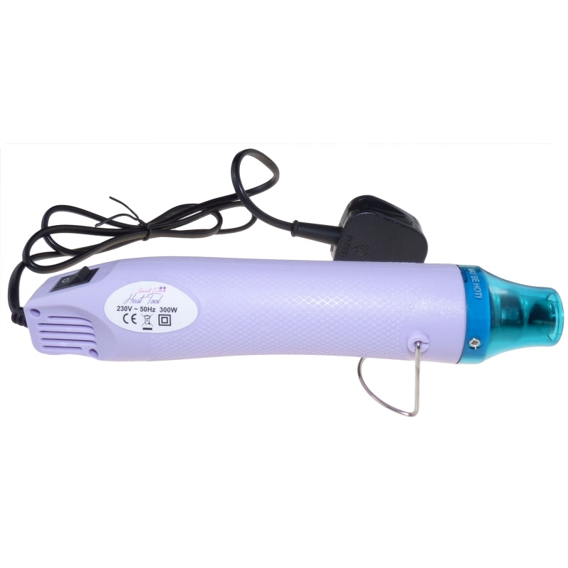 Sweet Dixie craft heat tool for embossing, light purple with teal nozzle, metal stand, and black power cord.
